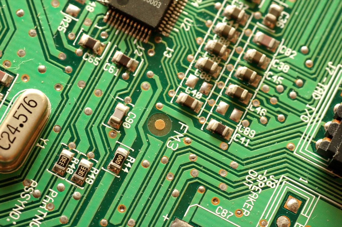 A close-up of components on an electronic circuit board