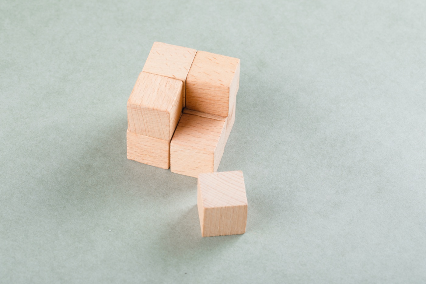 Wooden cubes arranged in a geometric composition