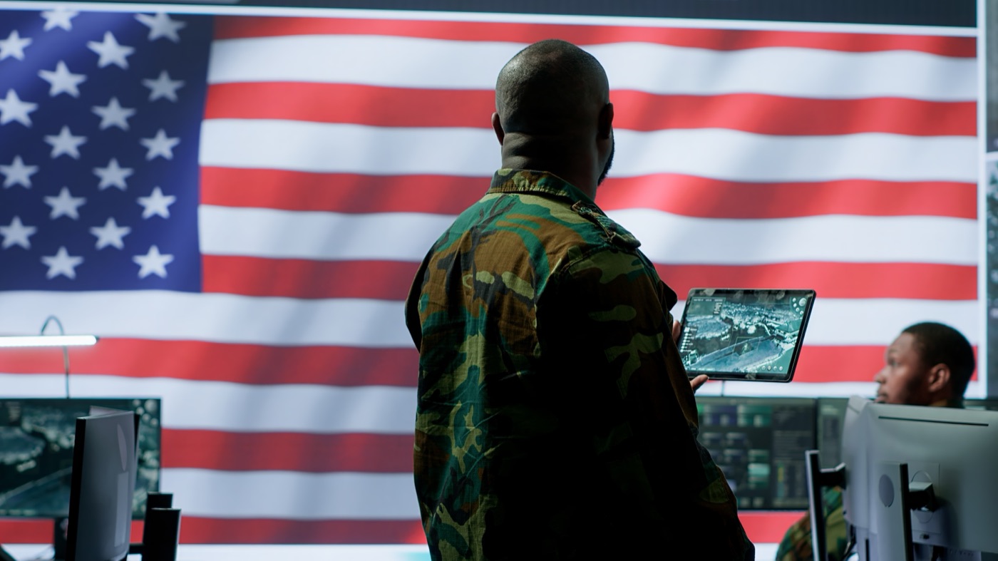 Military personnel working with surveillance screens
