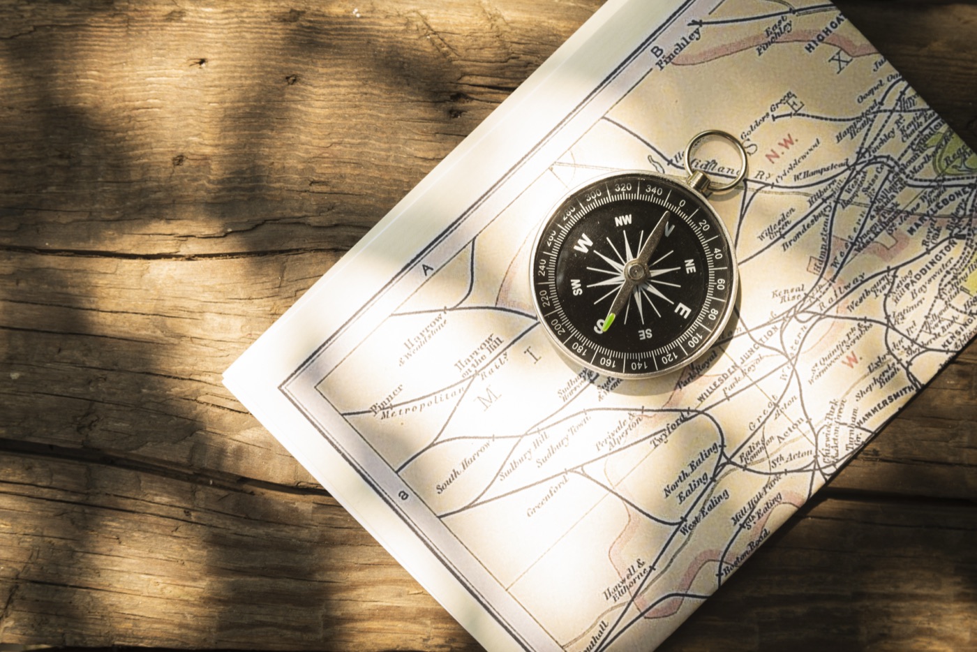 A compass resting on a map