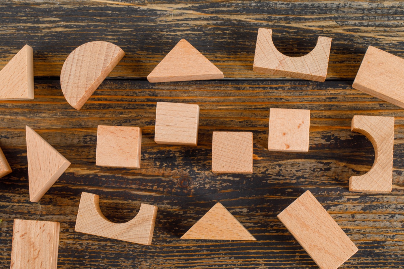 Geometric wooden shapes arranged on a table